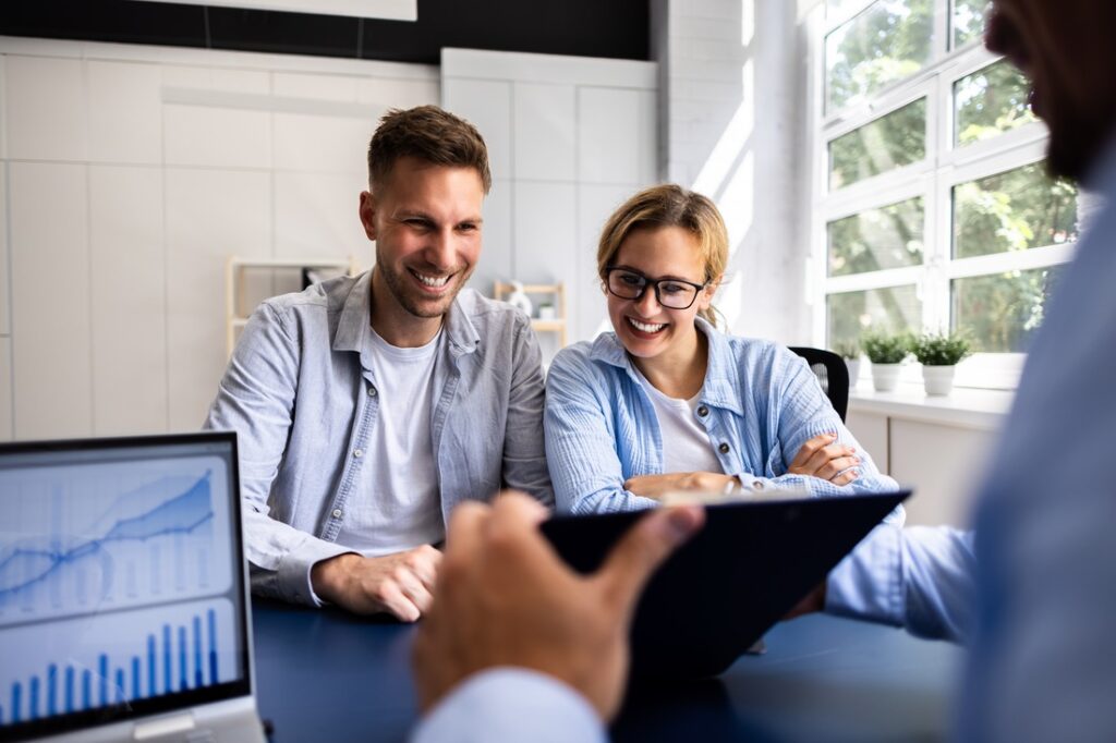 A financial planner meeting with a young couple