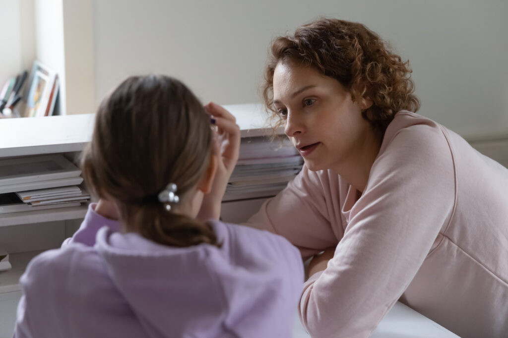 upset teenager with their mother